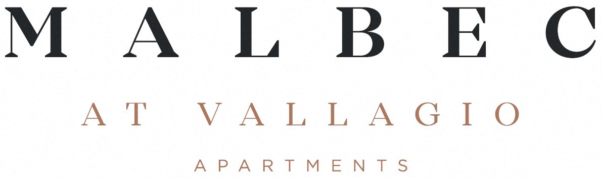 a logo with the words macbeth at valhalla apartments